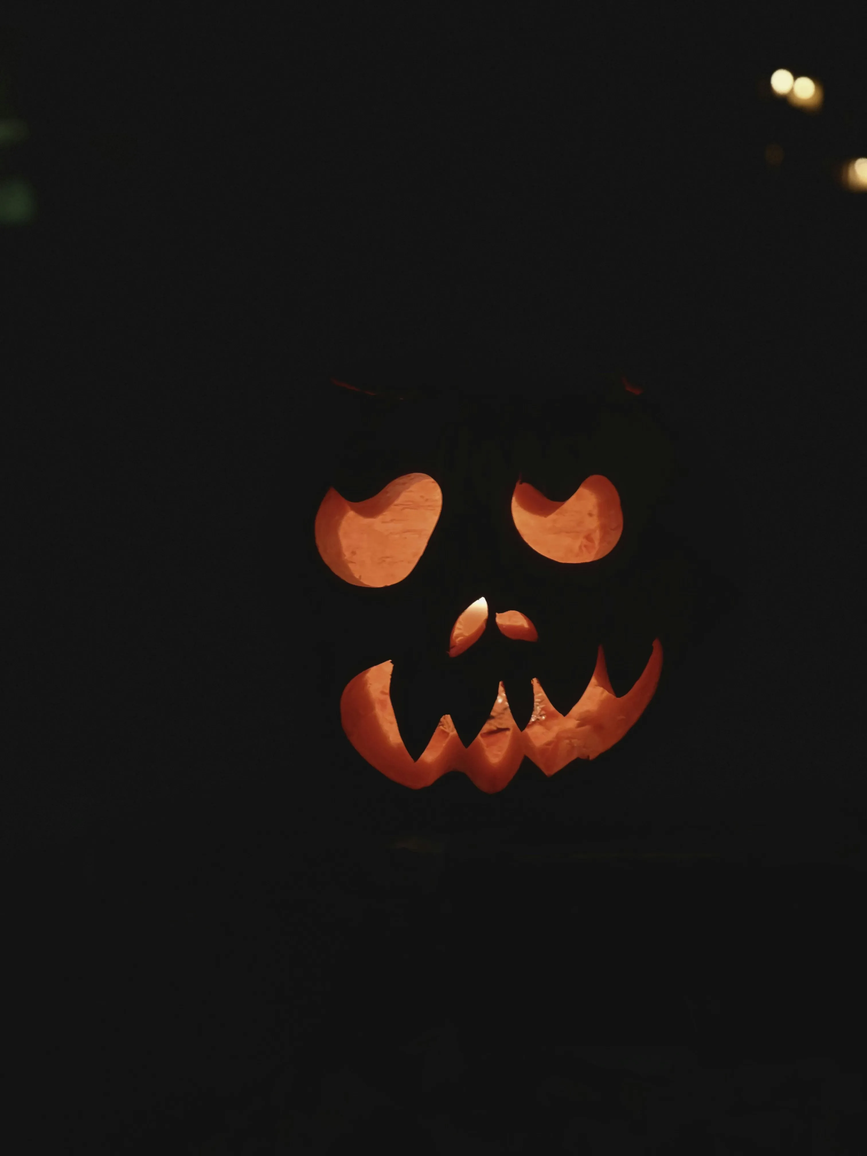 Simple Carved Pumpkin with Smiling Face in The Dark Image