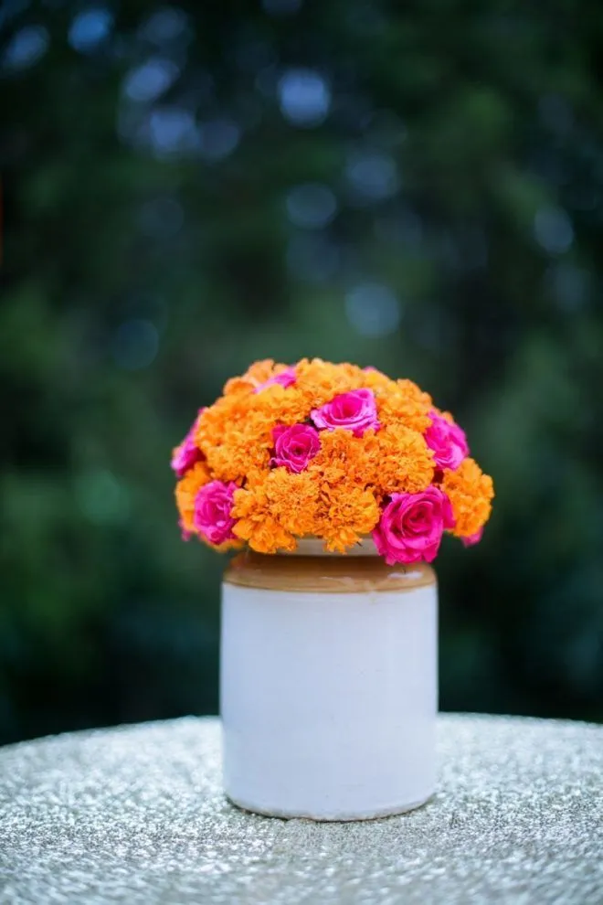 Simple marigold and rose Flower Pot Centerpiece HD image