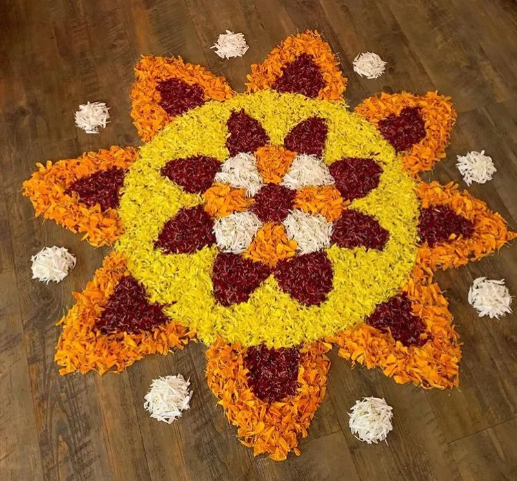 Simple Sun Shaped Onam Pookalam design with flowers image