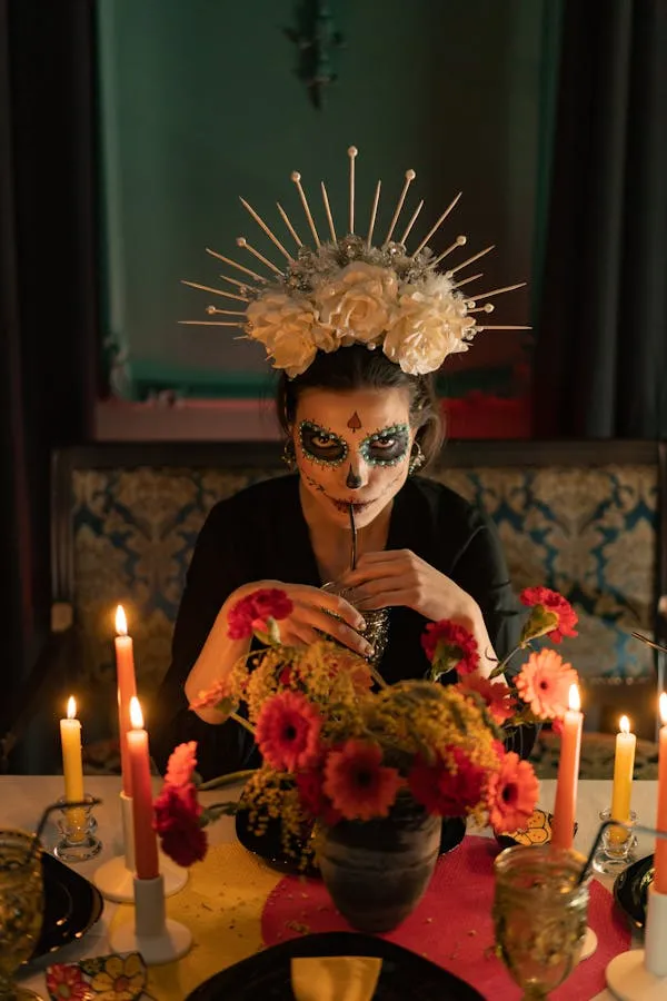 Skeleton makeup woman with golden crown and candles
