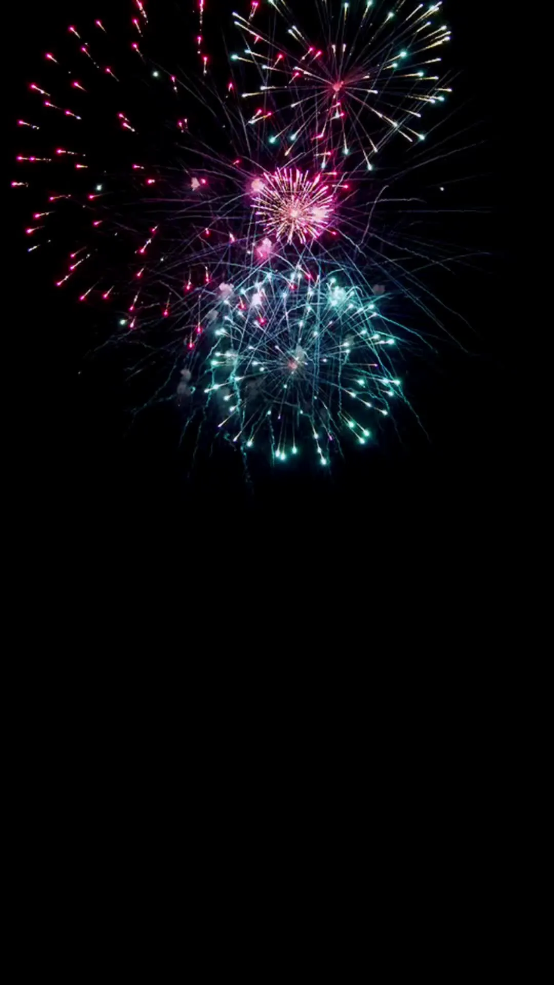 Small Colorful Fireworks Lighting up the Dark Sky image