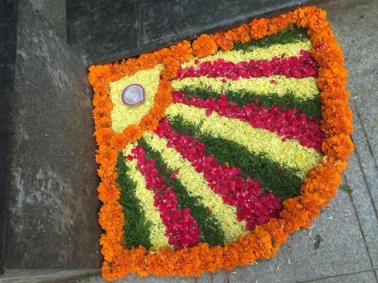 Small space pookolam with multicolours and diya wallpaper