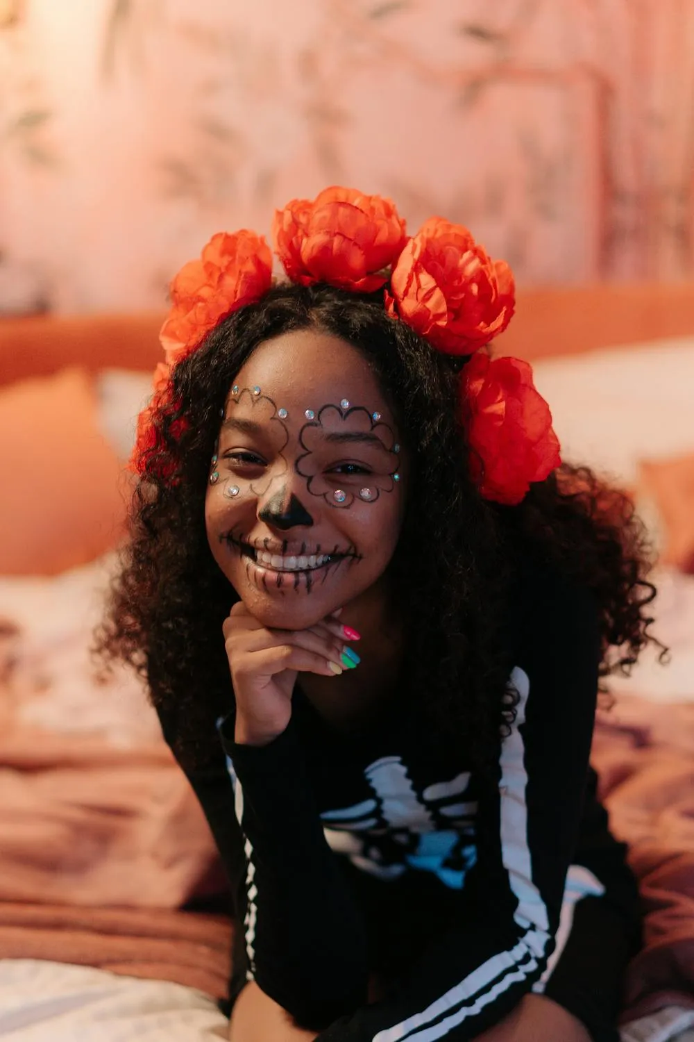 Smiling Woman with Floral Headpiece and Halloween Makeup