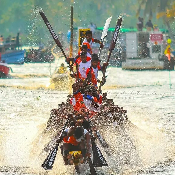 Snake boat race splashing through the river waters of Kerala