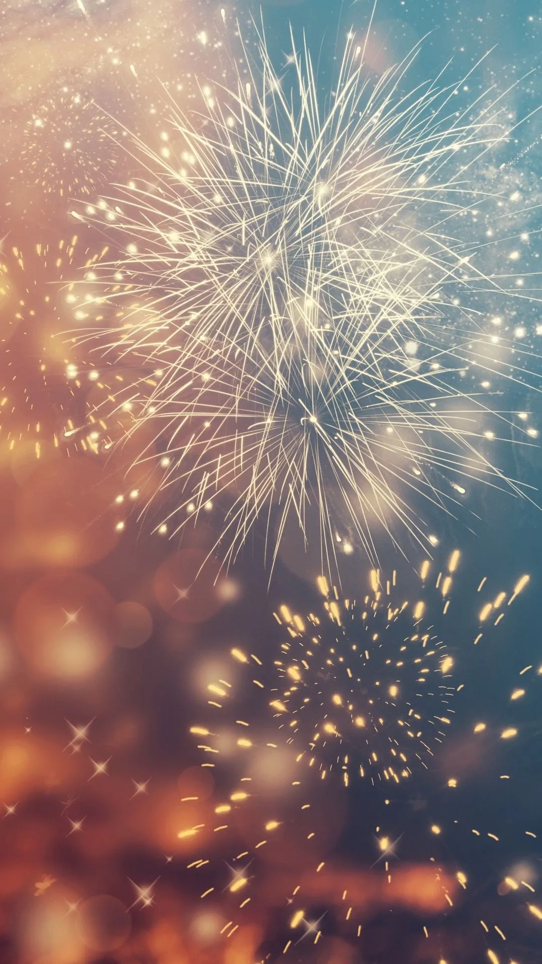Soft pastel toned fireworks create a dreamy glowing effect