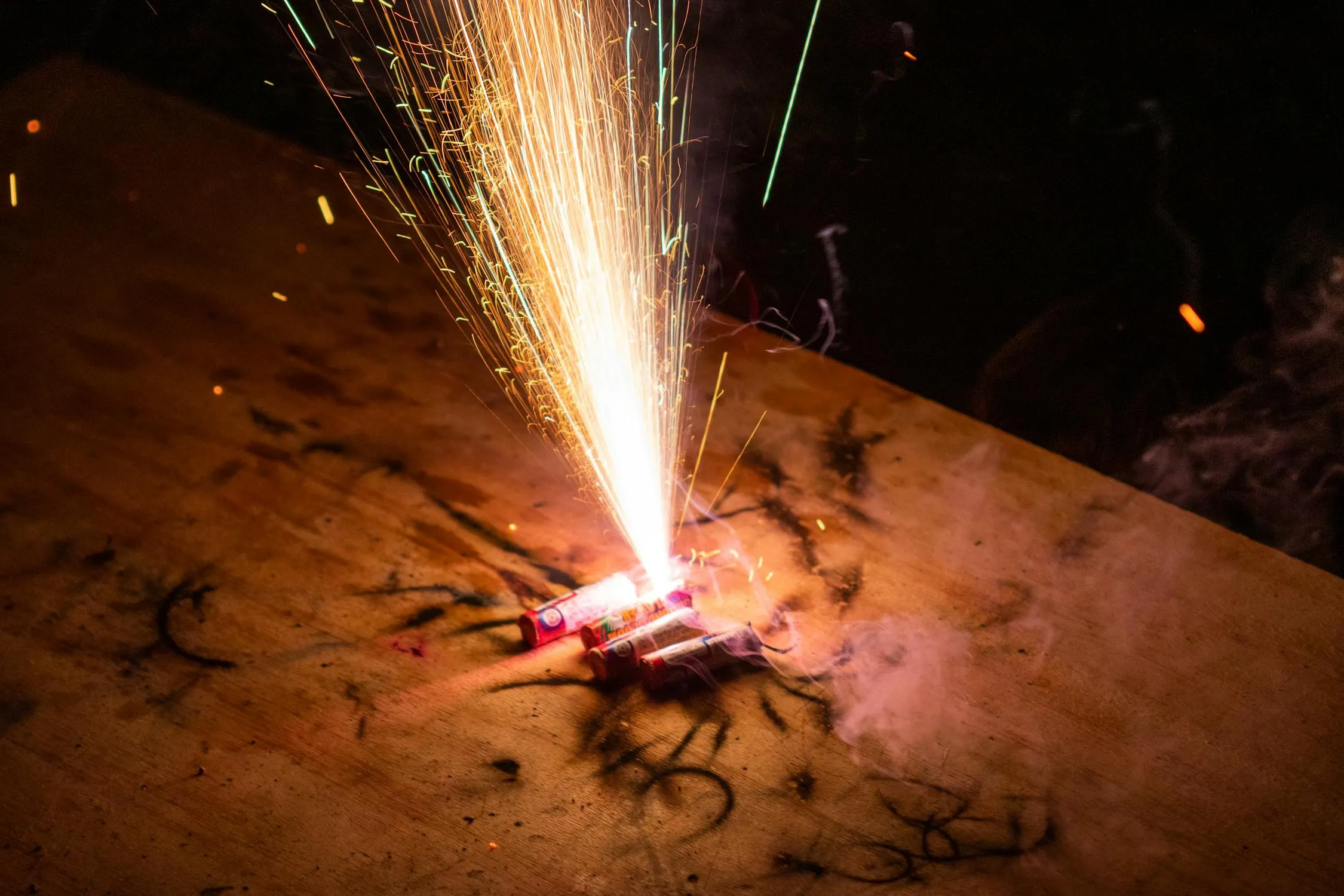 Sparkler and Fireworks in the Night Sky free HD image