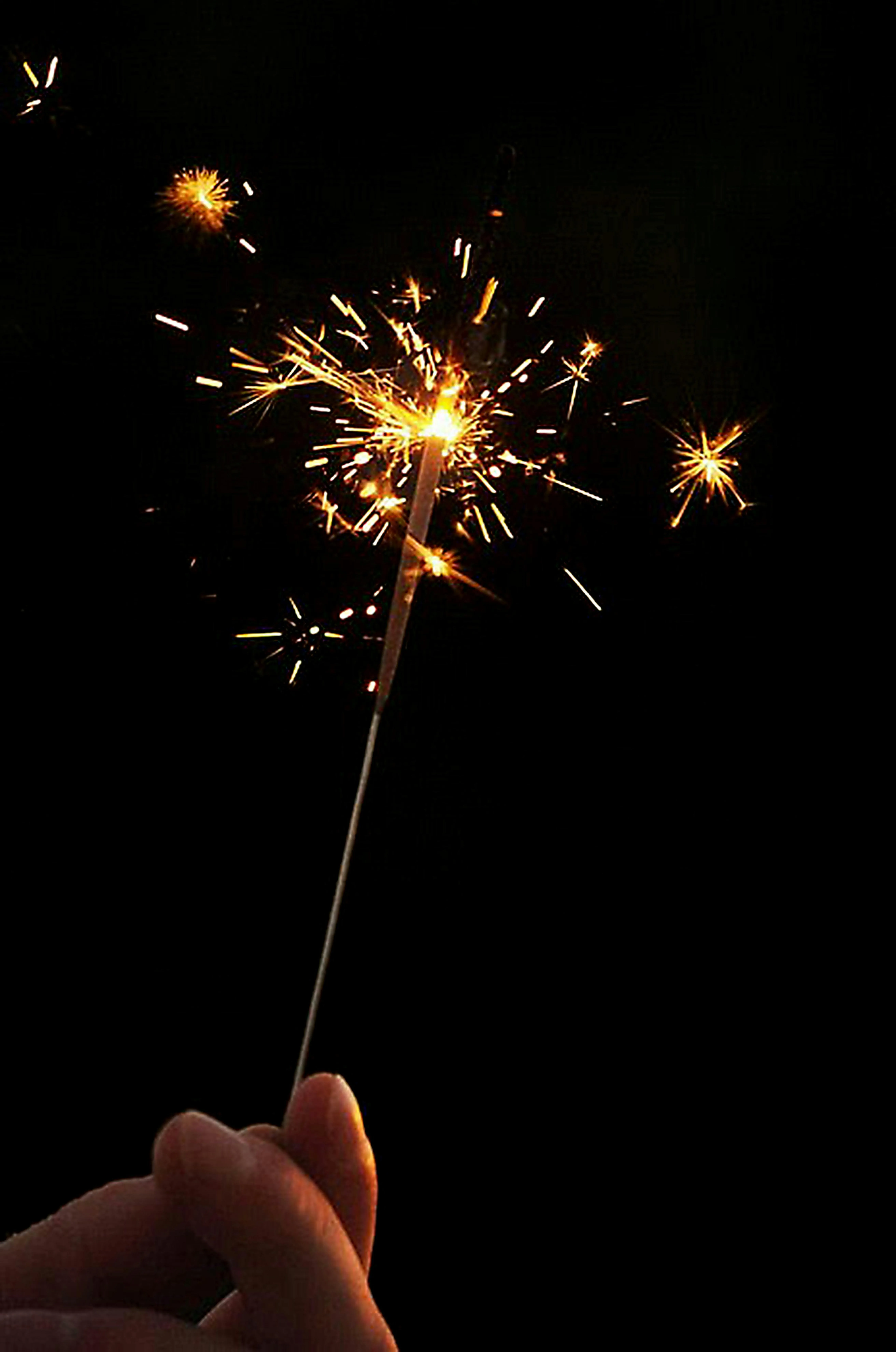 Sparkler in hand creating a dazzling light display