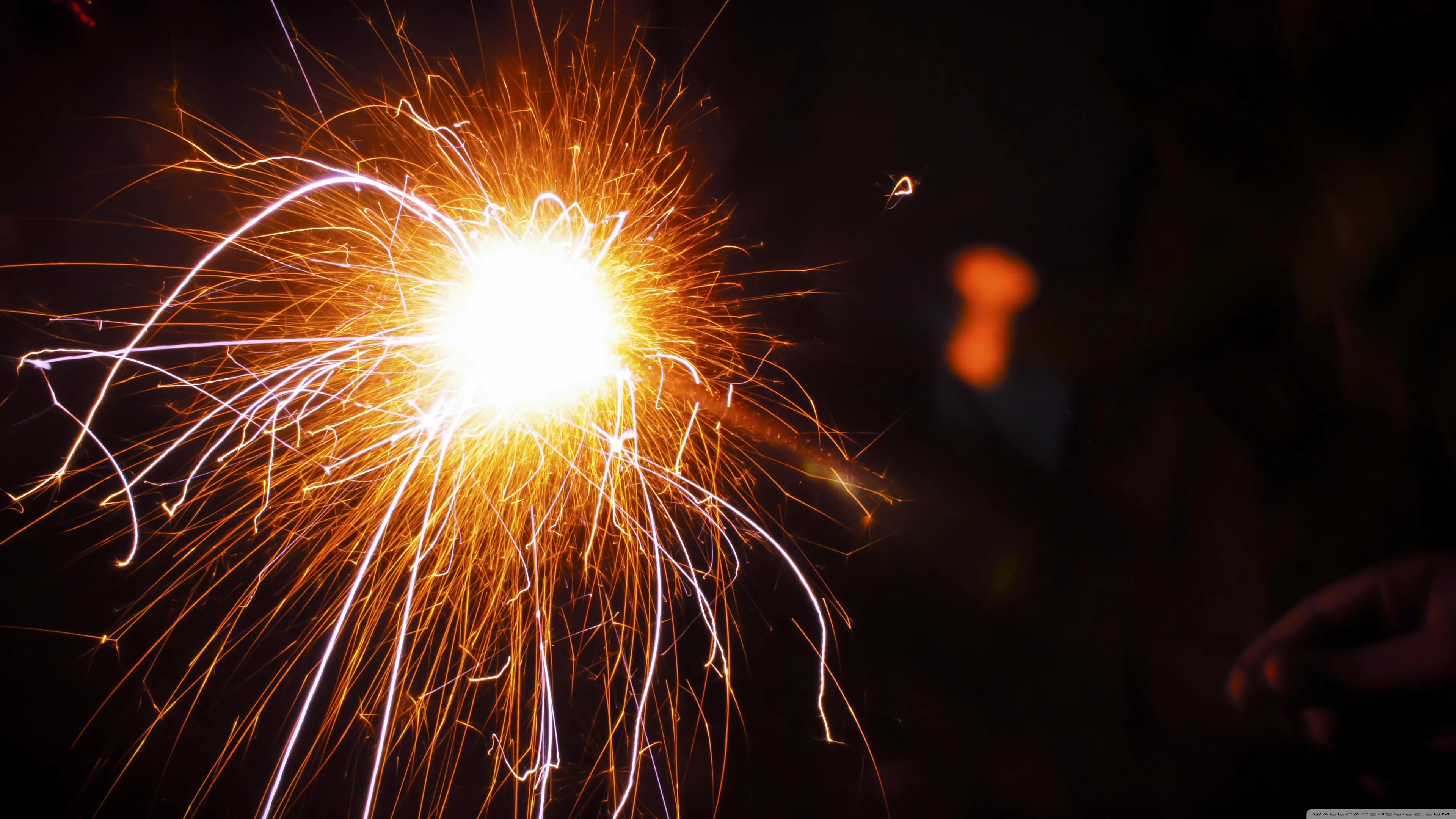 Sparkler with Bright Fiery Explosion at Night image