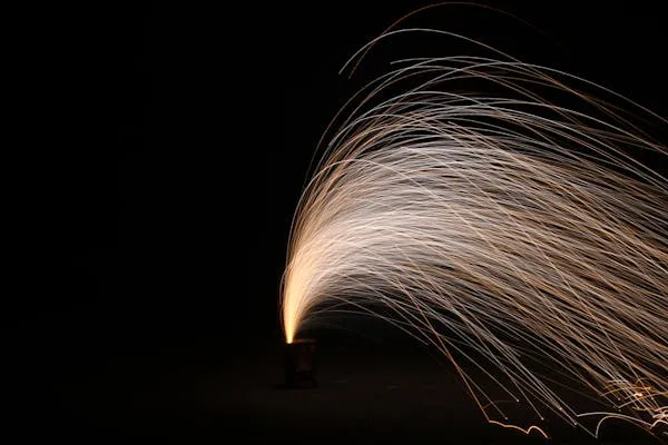 Sparkling Firework Trails in the Dark Night Air Wallpaper