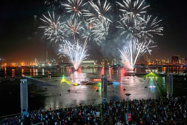 Spectacular Fireworks Light up the Sky over a Crowd