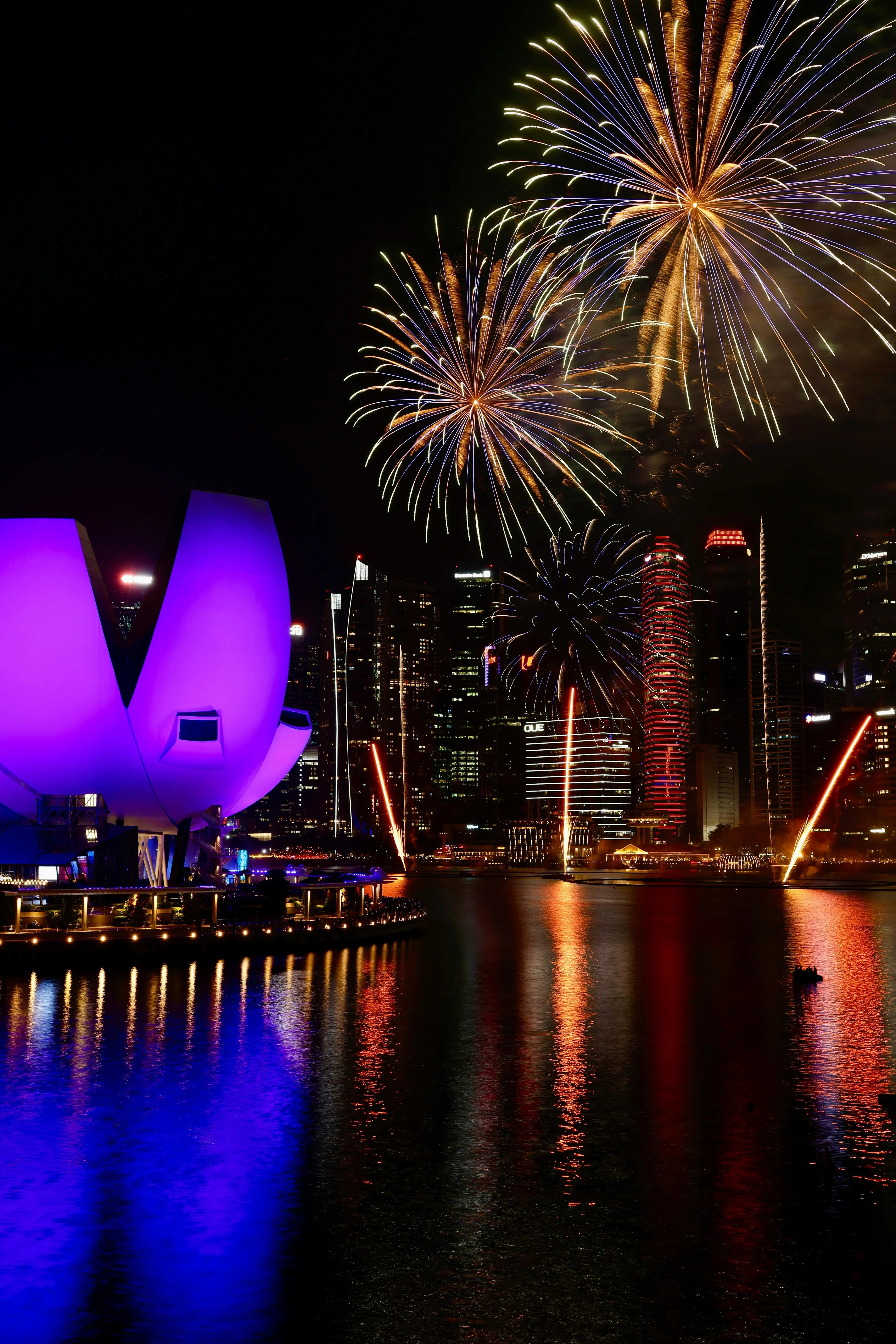 Spectacular fireworks over the city skyline at night