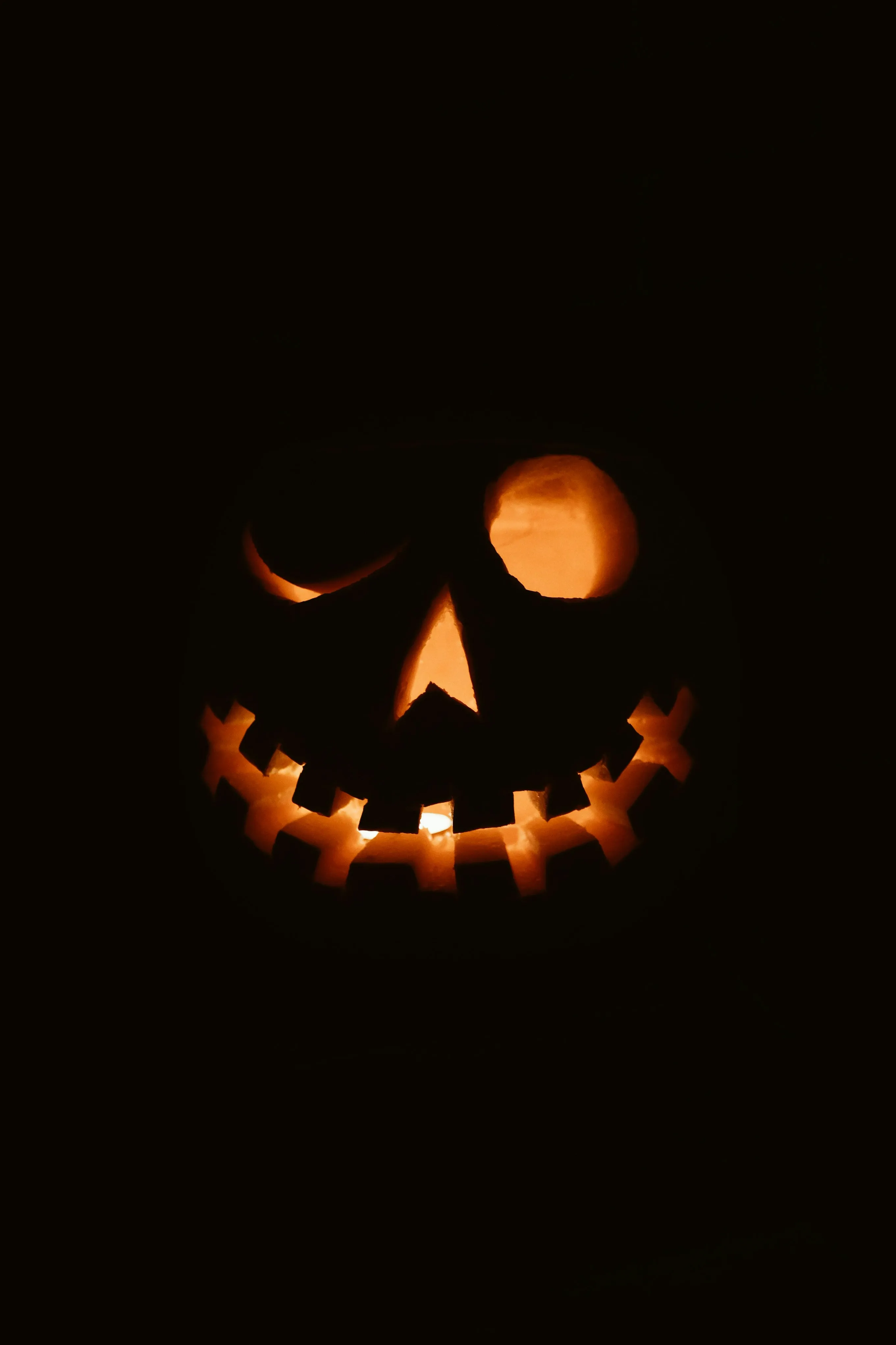 Spooky Glowing Jack O Lantern in Dark Night Wallpaper