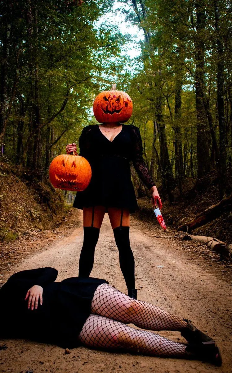 Spooky Halloween Scene Pumpkin Head Holding Knife Outdoors