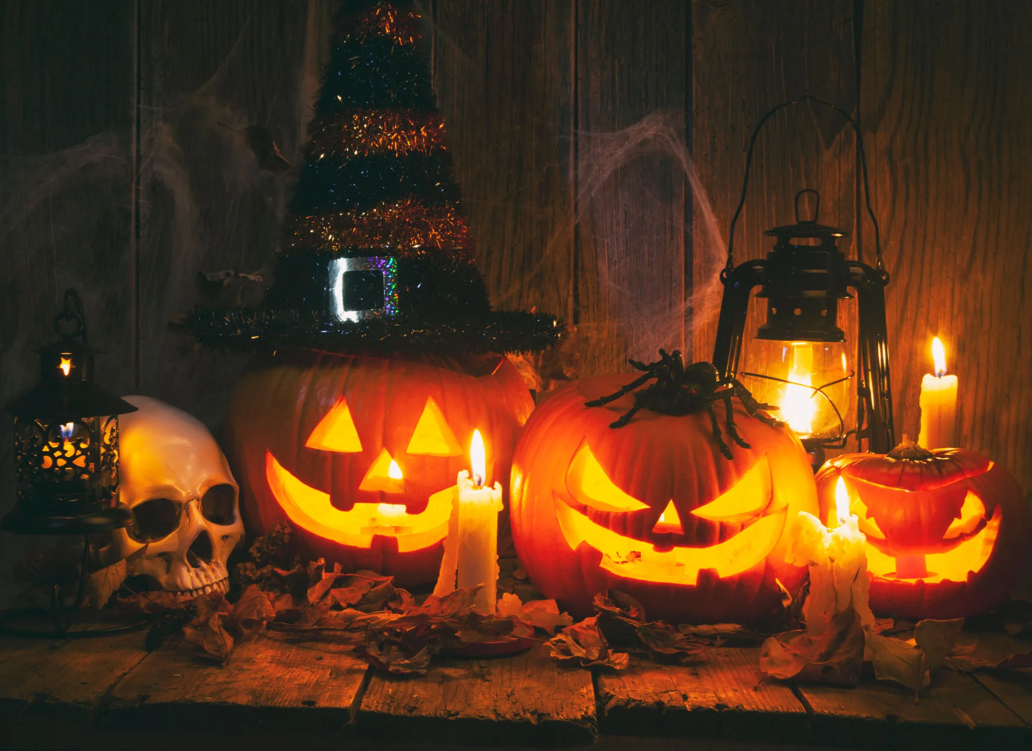 Spooky Halloween Scene with Pumpkins Candles and Skulls