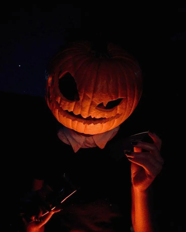 Spooky Pumpkin Head Costume in the Dark with Shadows