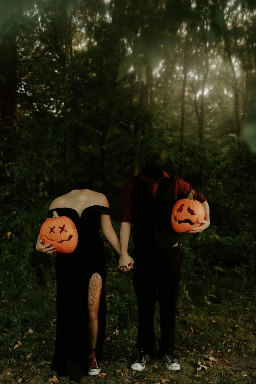 Spooky Pumpkin Head Duo Hiding Behind Trees Wallpaper