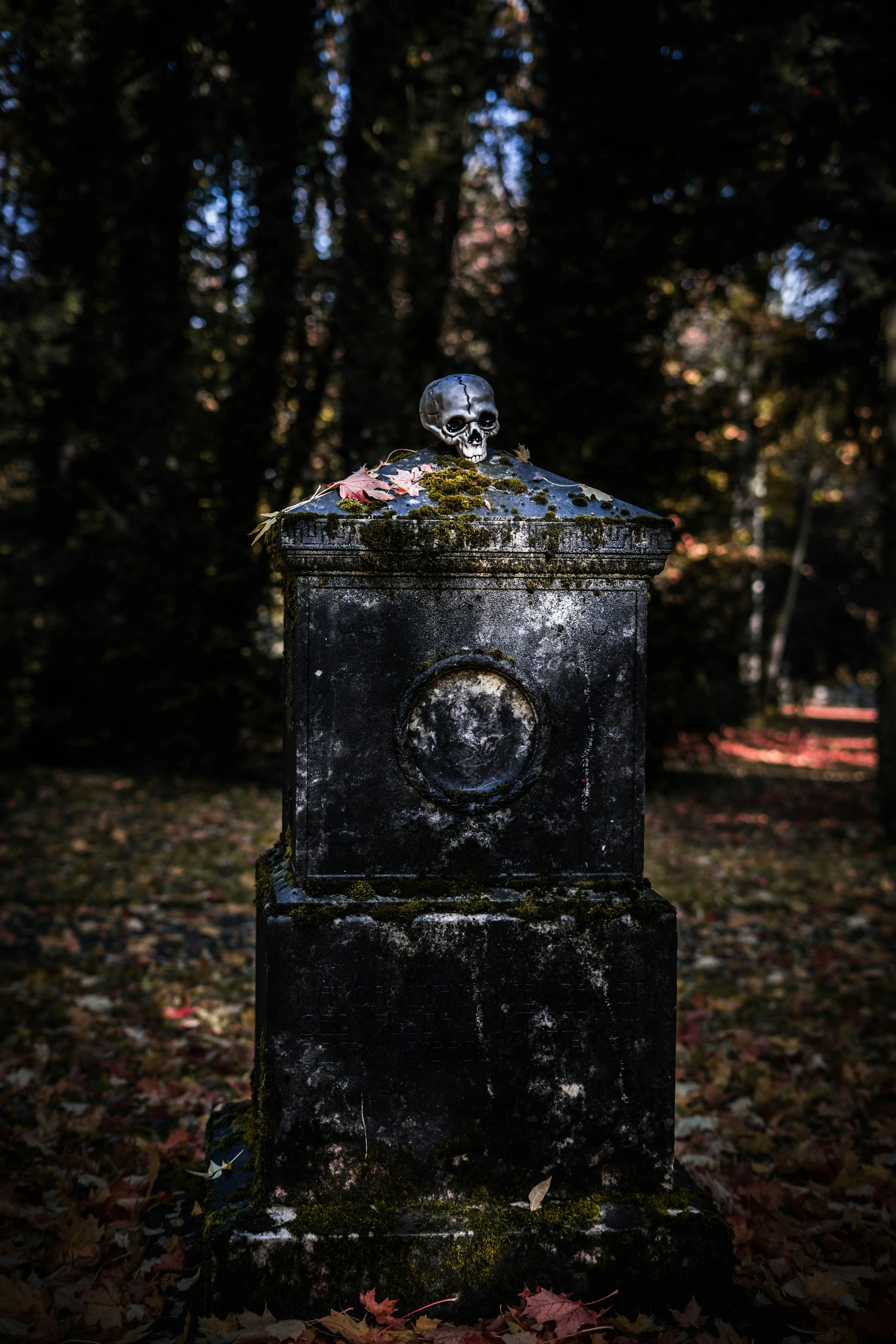 Spooky Tombstone Surrounded by Fall Leaves HD Wallpaper