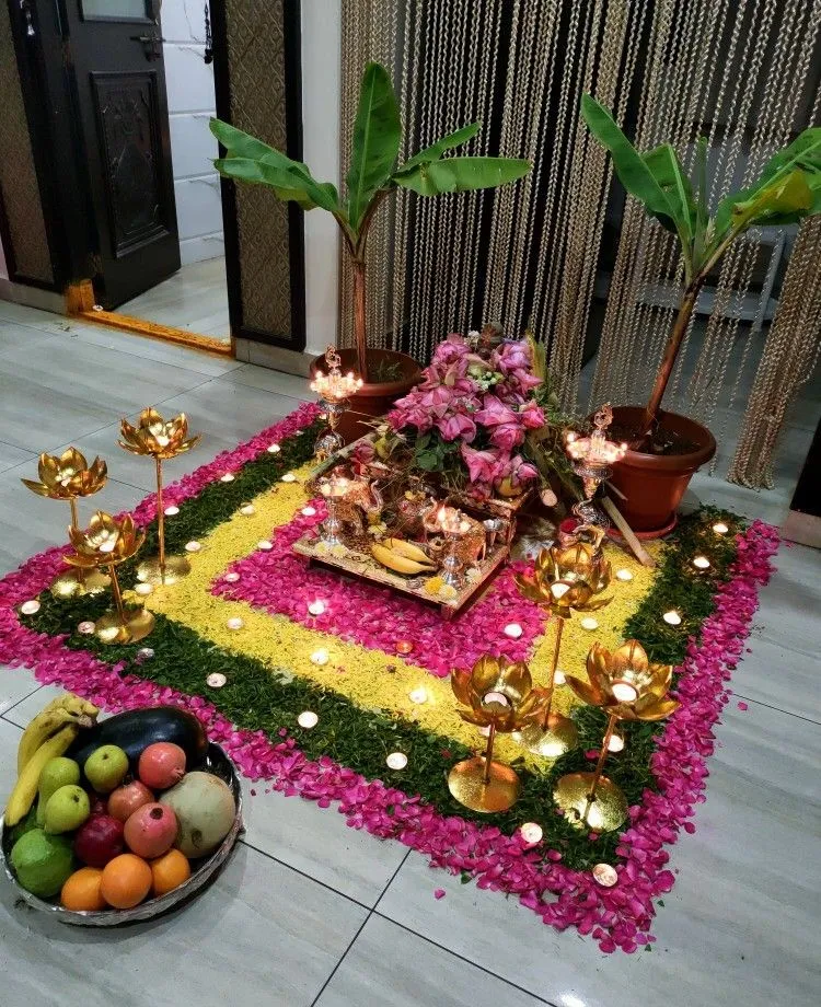 Square Onam pookolam decoration with potted plants and fruits
