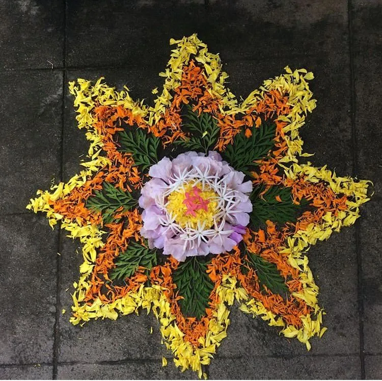 Star pattern Athapookolam with fresh flowers and leaves