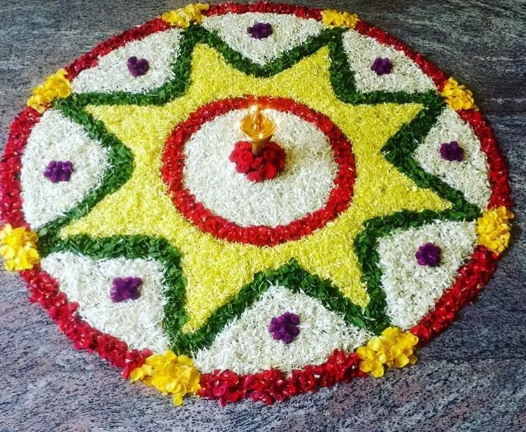 Star pattern floral Athapookolam with central lamp Wallpaper