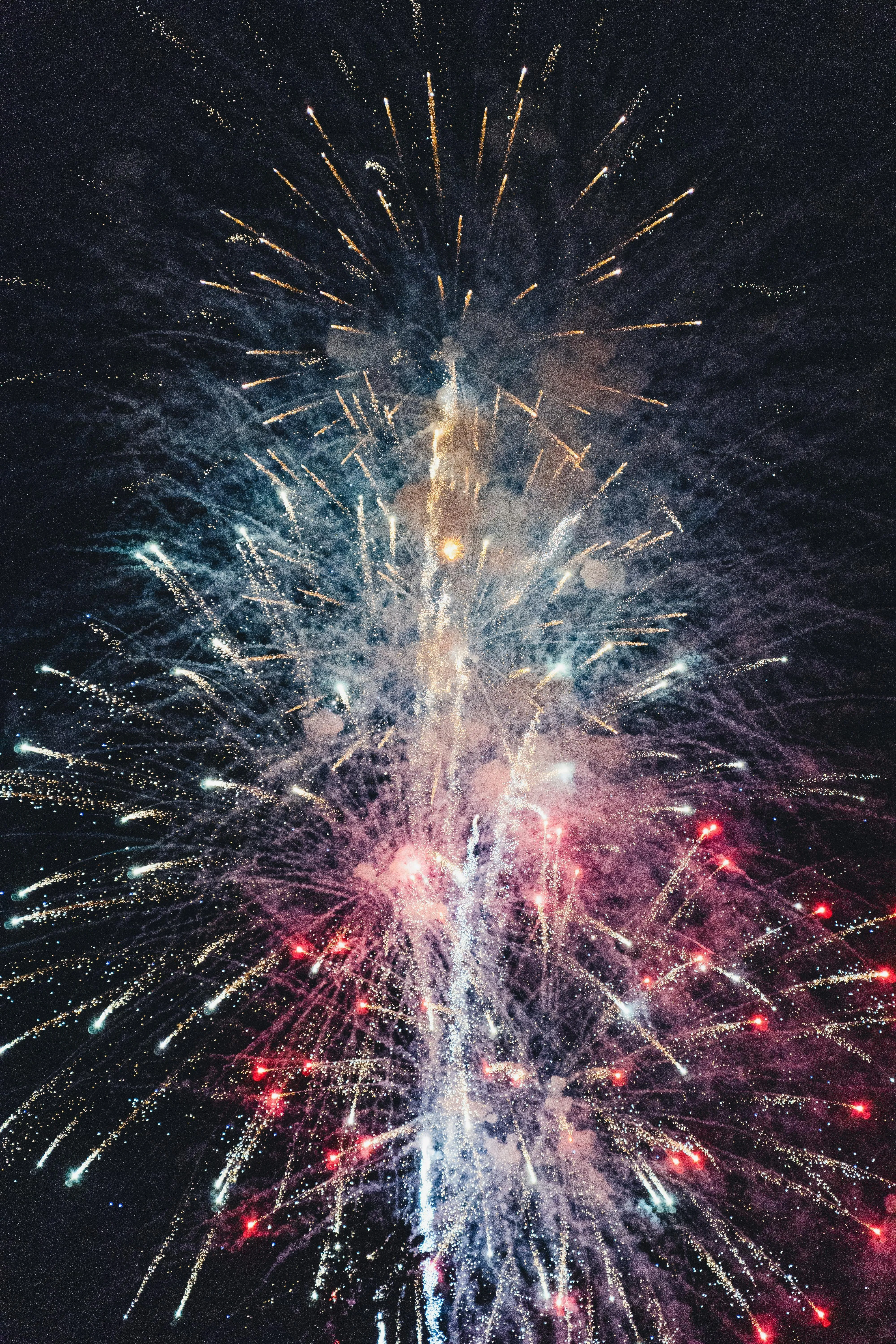 Starburst Fireworks Illuminating the Sky at Night Wallpaper