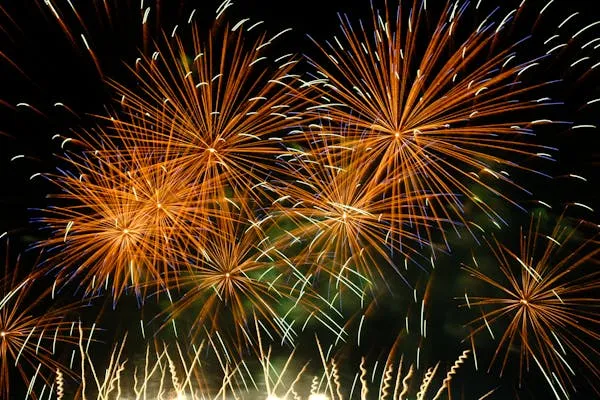 Striking Colorful fireworks bursting in vibrant orange hues