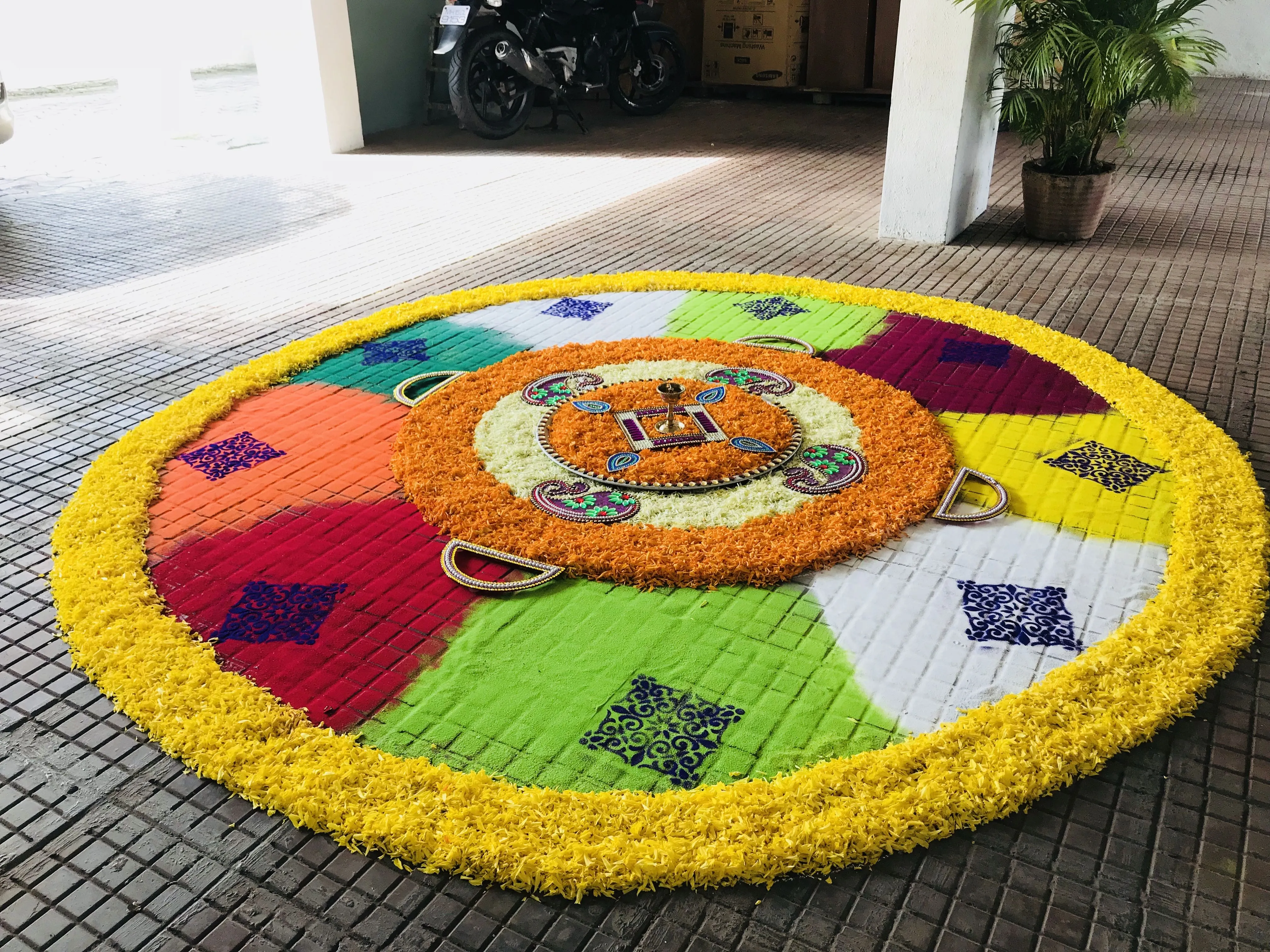 Stunning Athapookolam with colourful segments and beads