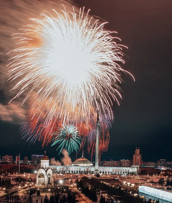 Stunning Fireworks Display over a Cityscape at Night