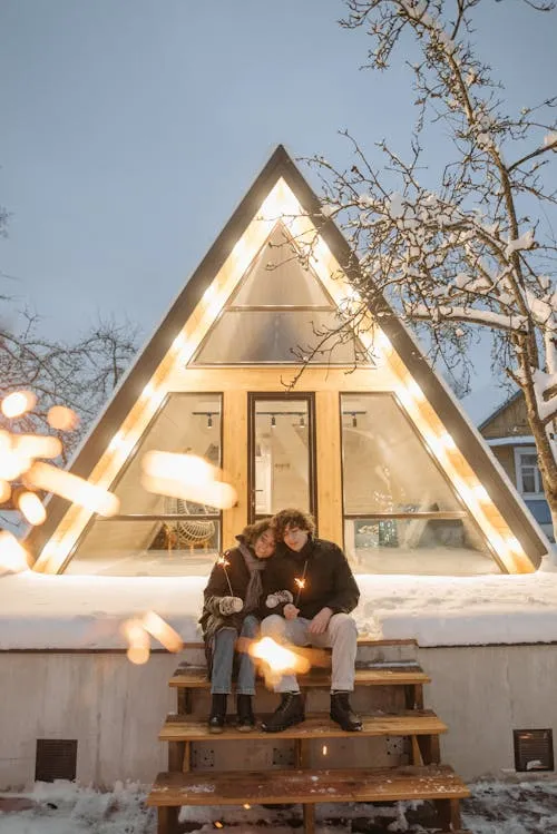 Stunning Fireworks Show with Snow Capped House Background