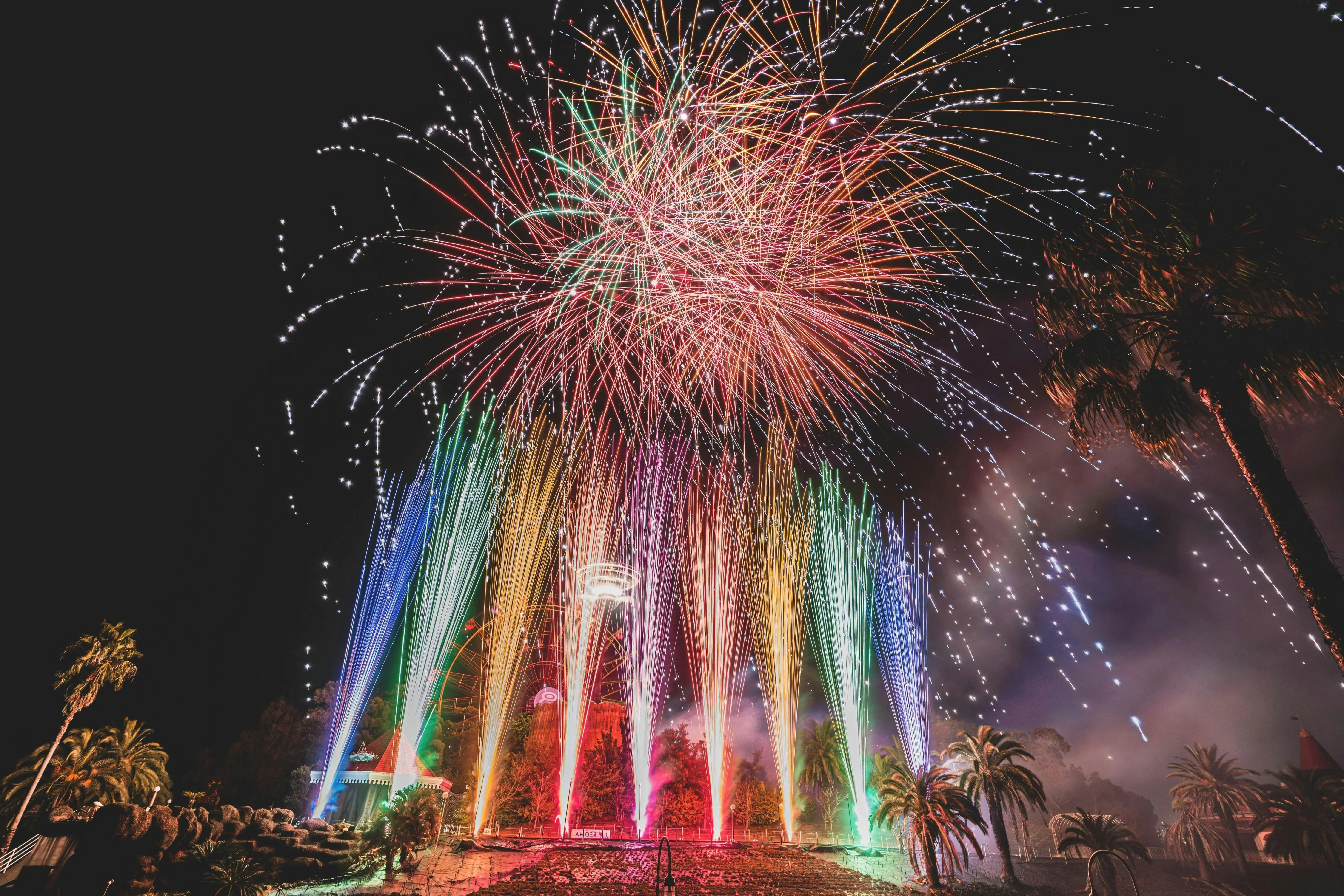 Stunning fireworks with rainbow lights bursting in the night