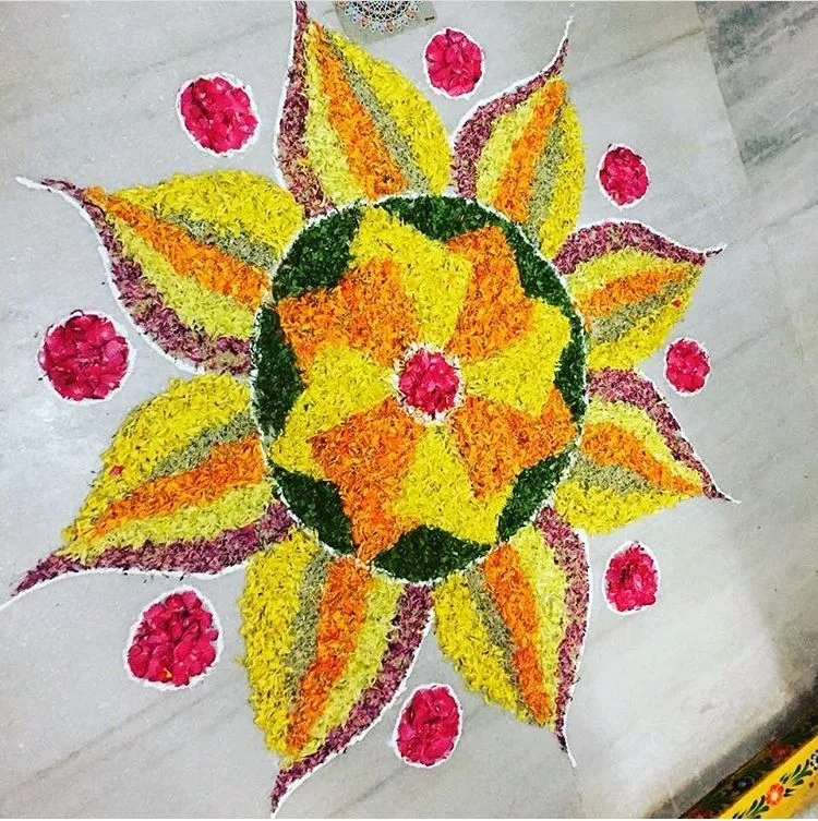 Sun design floral pookolam with petal layers Wallpaper
