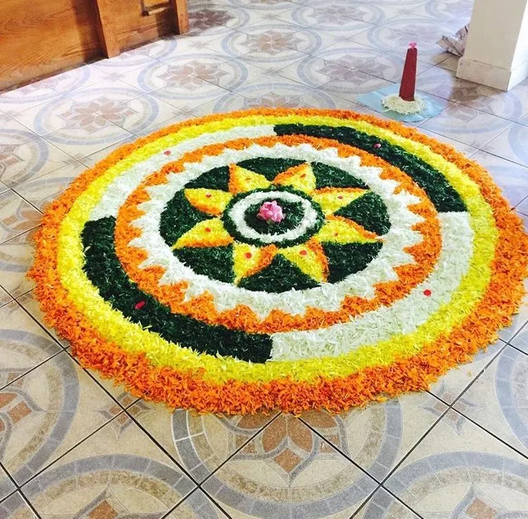 Sun pattern centerpiece with circular marigolds petals image