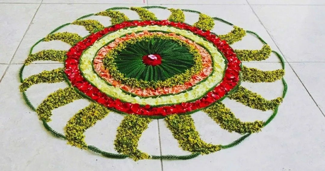 Sun pattern floral pookolam with vibrant petals Wallpaper