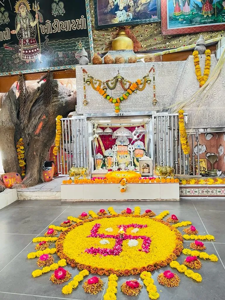 Swastik Athapookolam design with Marigold and rose petals