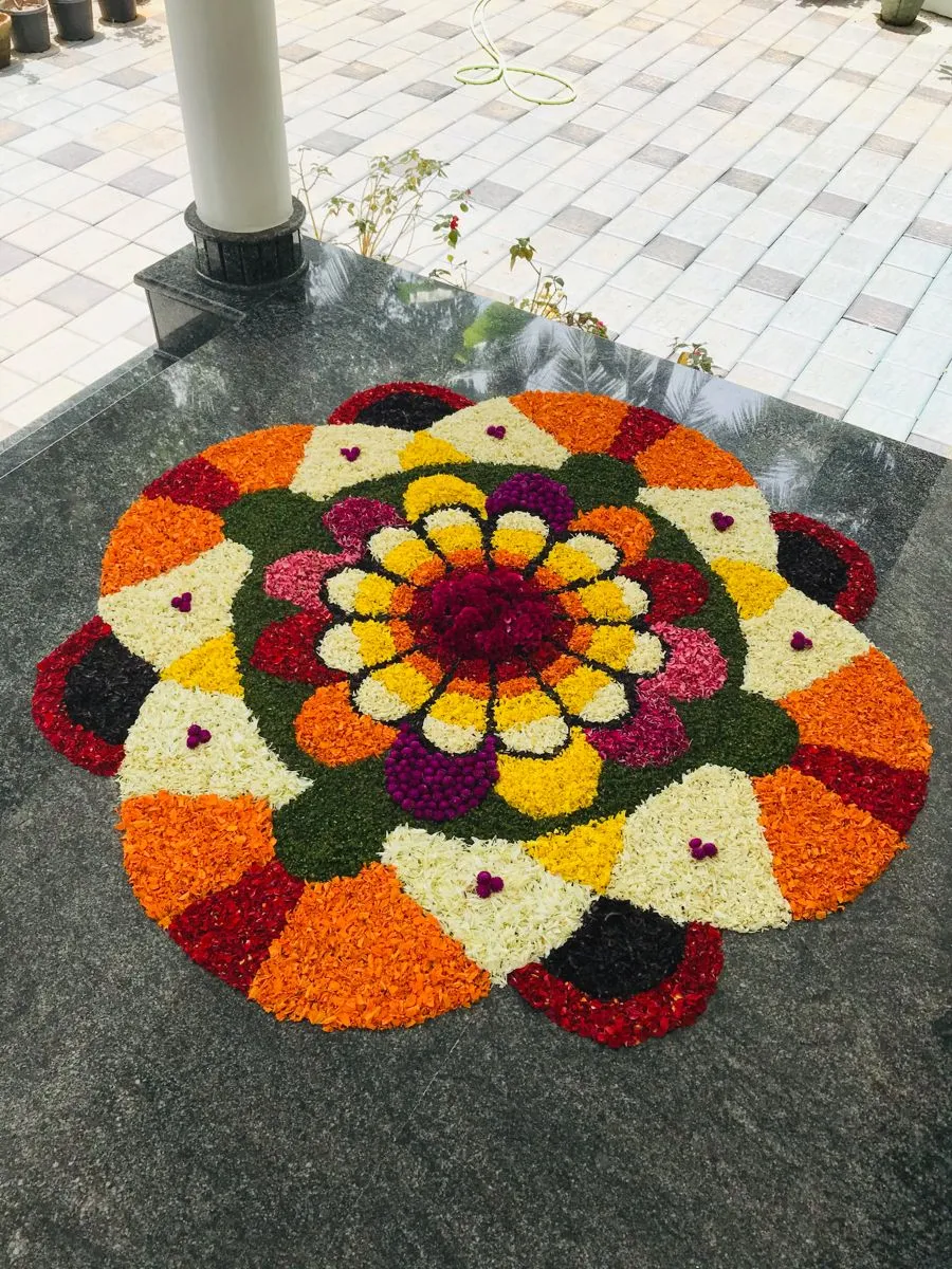Symmetrical pookalam design for Onam Home decoration image