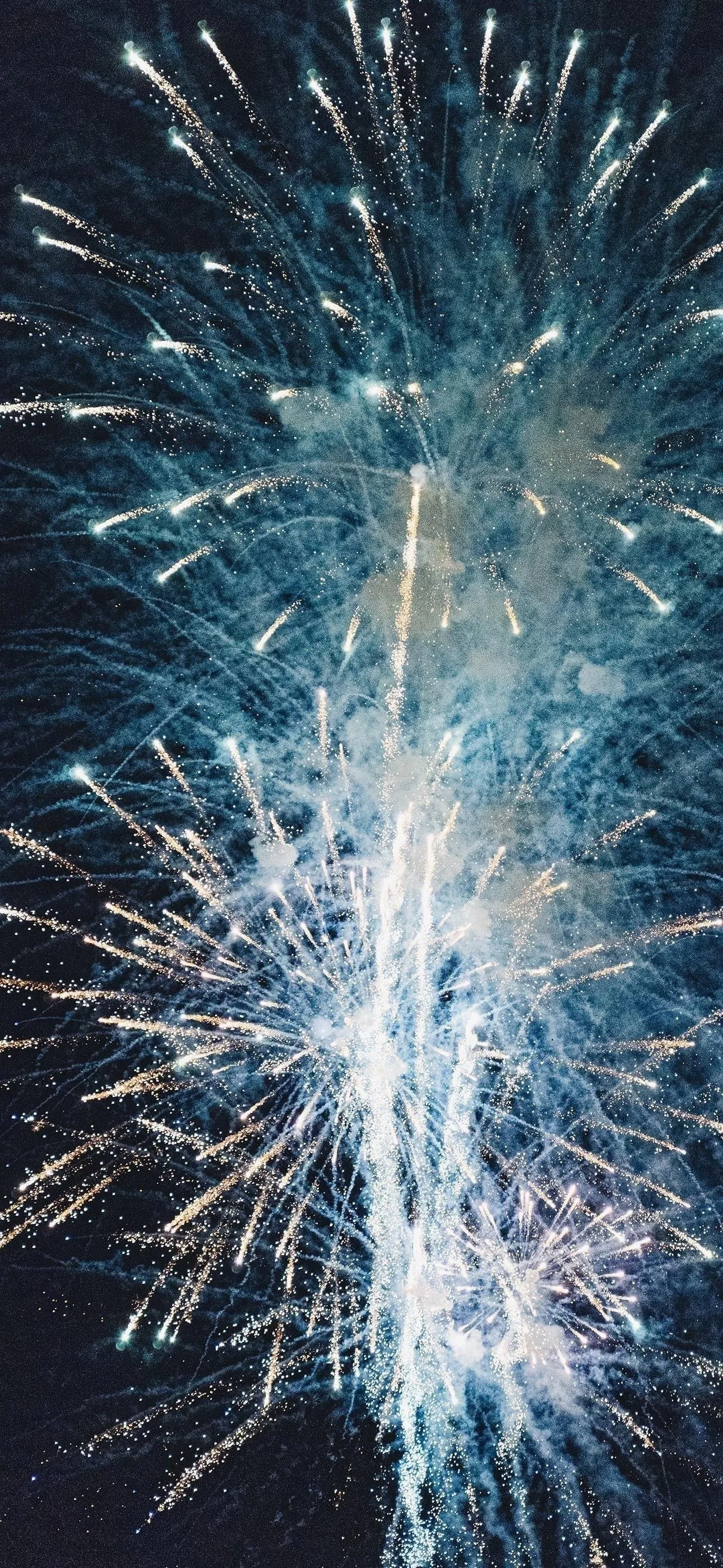 Tall colorful fireworks creating a dramatic display image