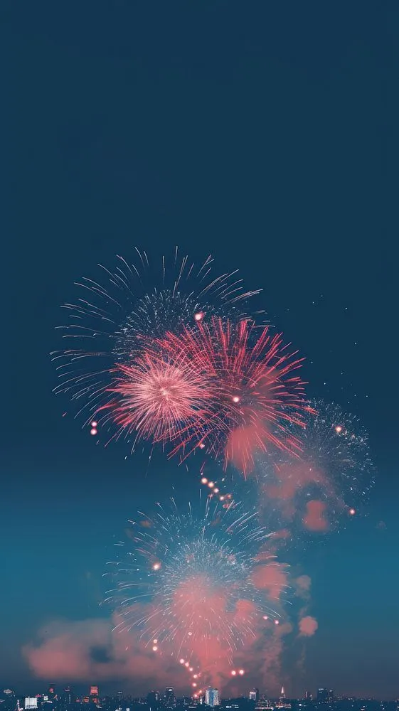 Tall Fireworks Lighting the Night Sky in Layers Wallpaper