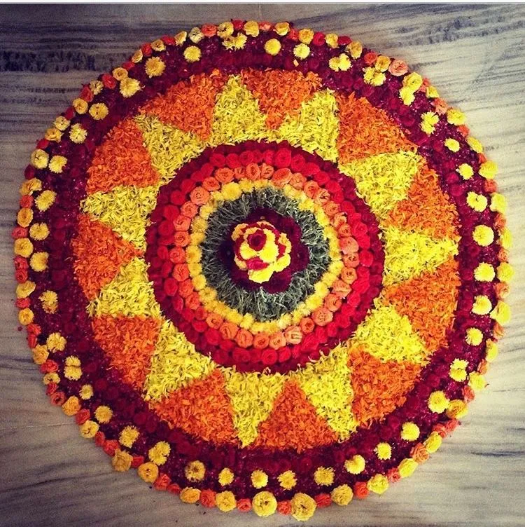 Traditional Circular Onam Pookalam with rose and marigols