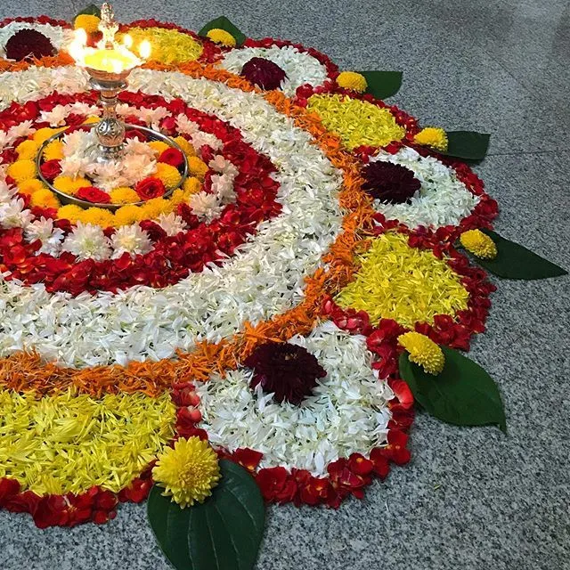 Traditional Pookolam with Lamp for Onam Celebration HD
