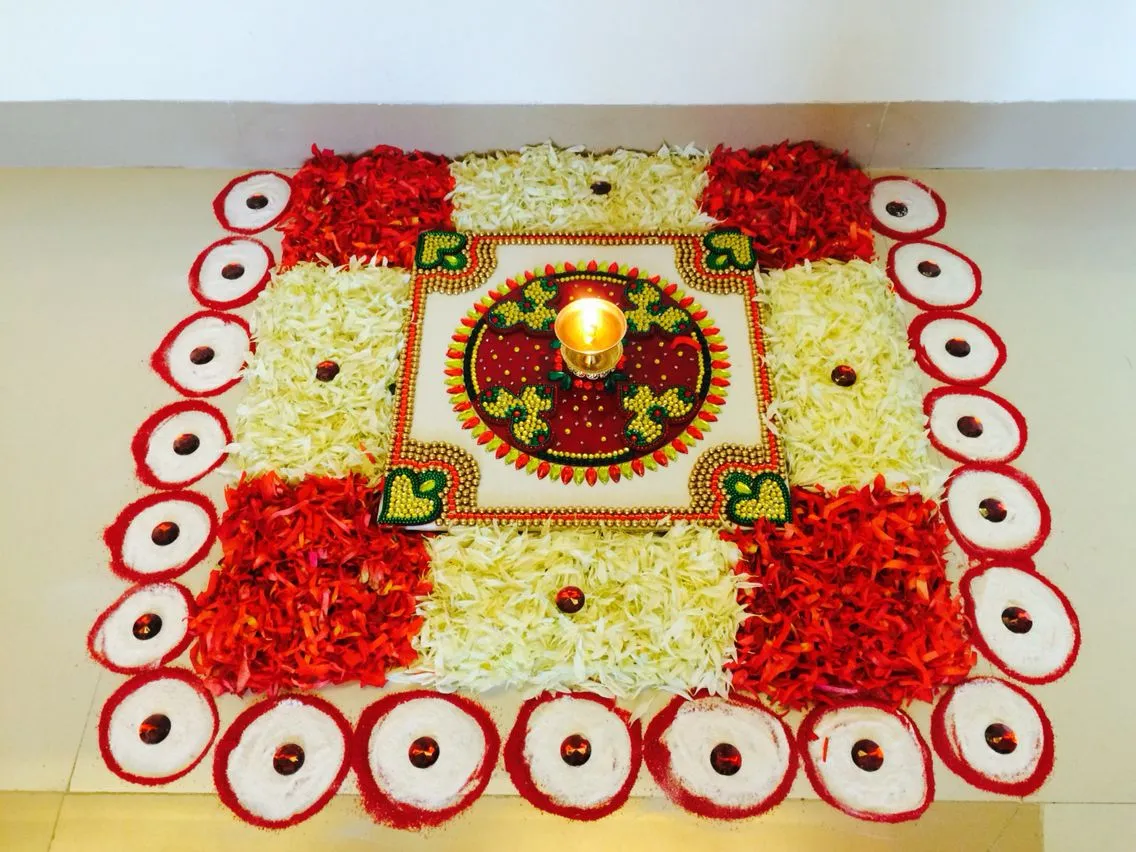 Traditional square floral rangoli with Diya Decoration image