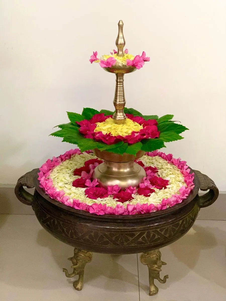 Traditional uruli with lamp and Flowers for Decoration image