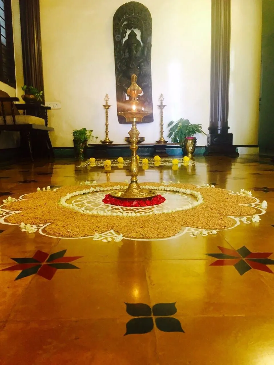 Traditional wheat Rangoli with Lamp and Flower Decoration