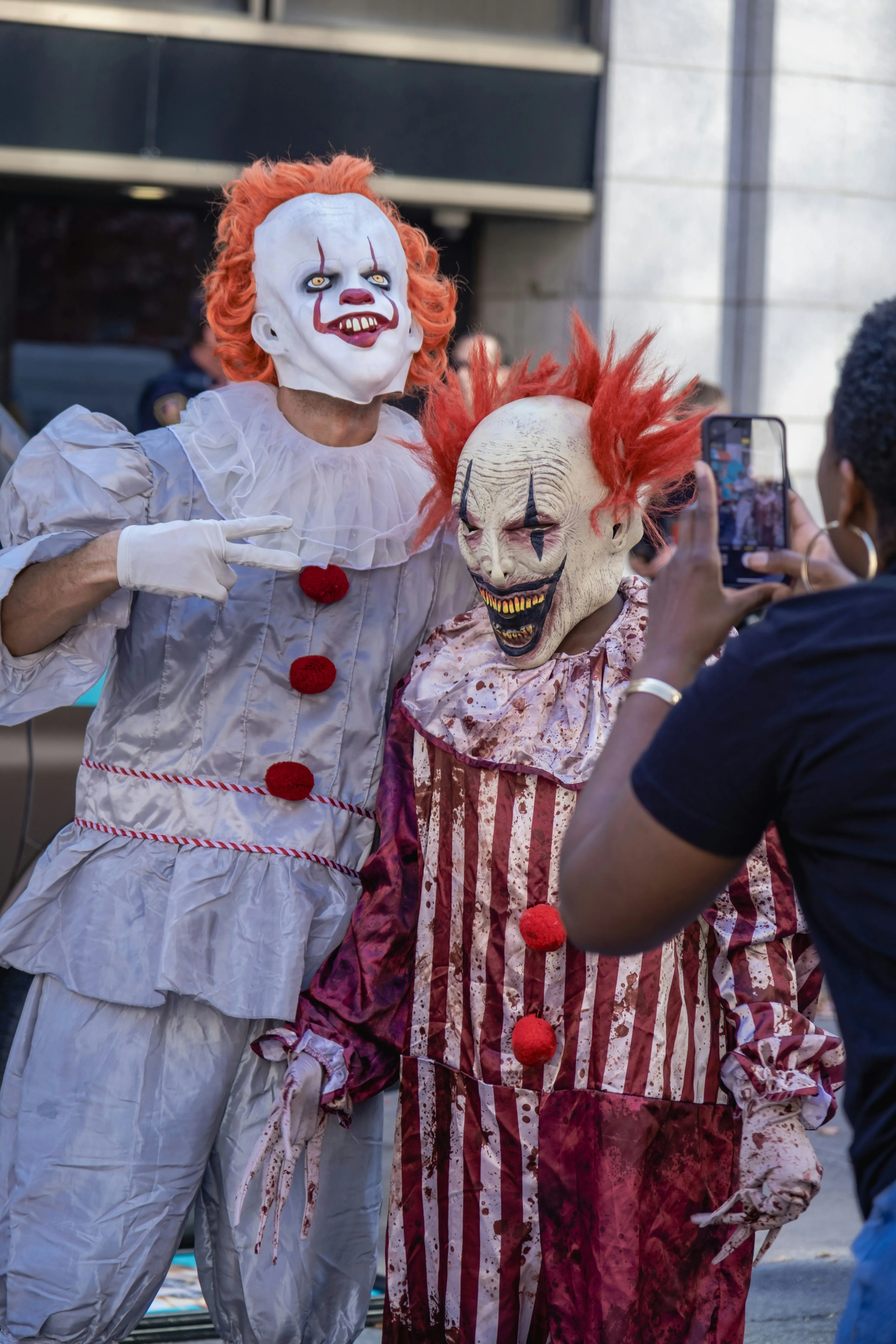 Two Clowns in Scary Makeup at Halloween Event Wallpaper