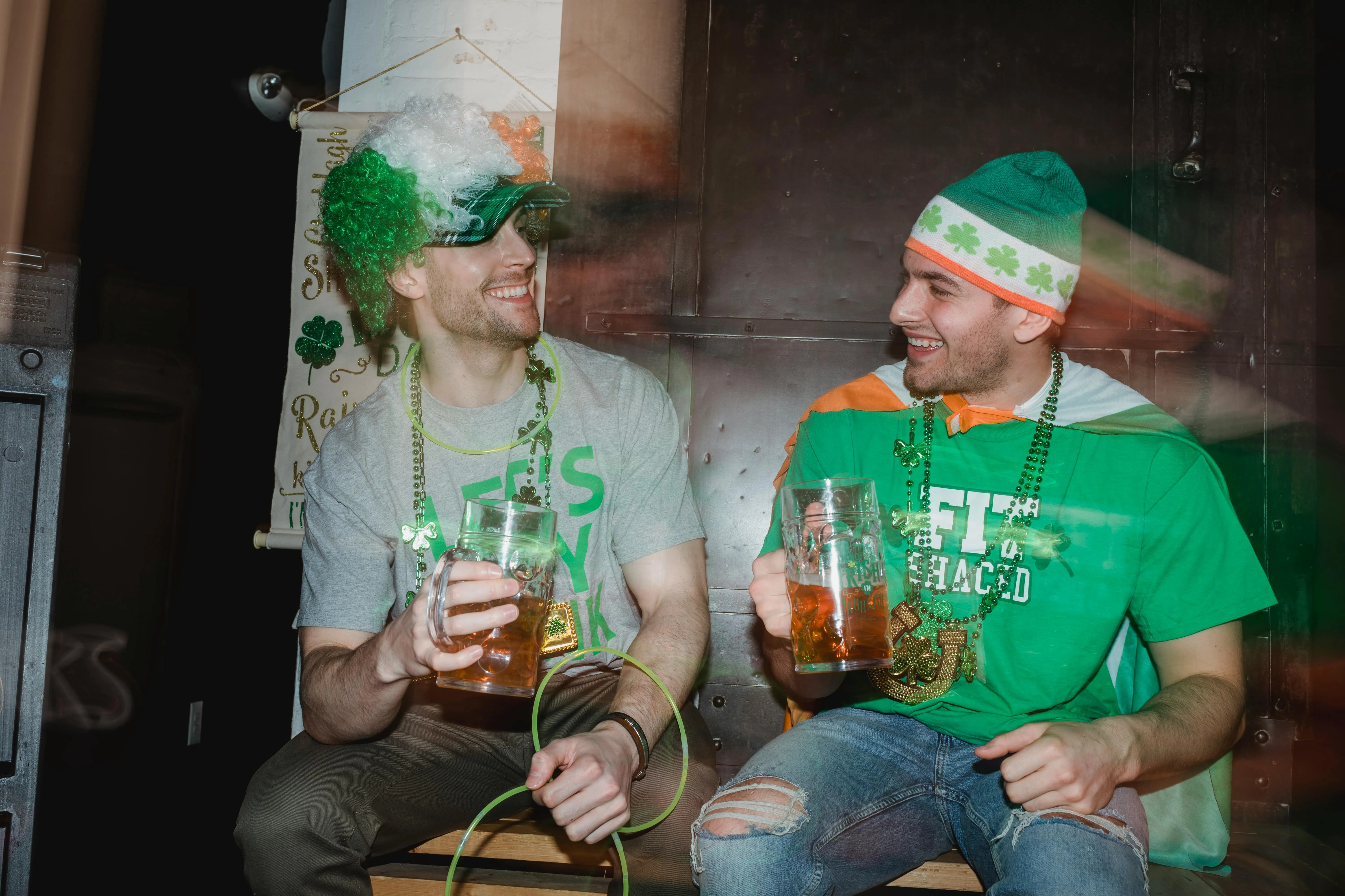 Two Friends Enjoying Drinks at Halloween Party Wallpaper