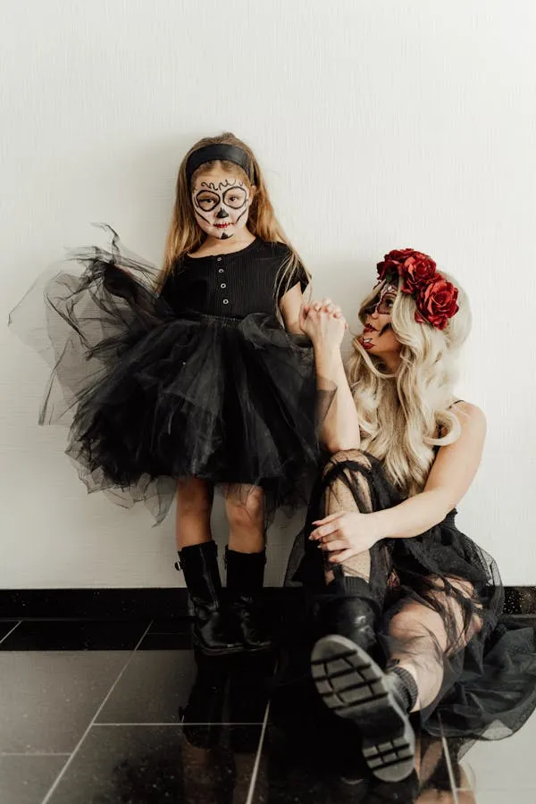 Two girls in Halloween costumes at a festival Wallpaper