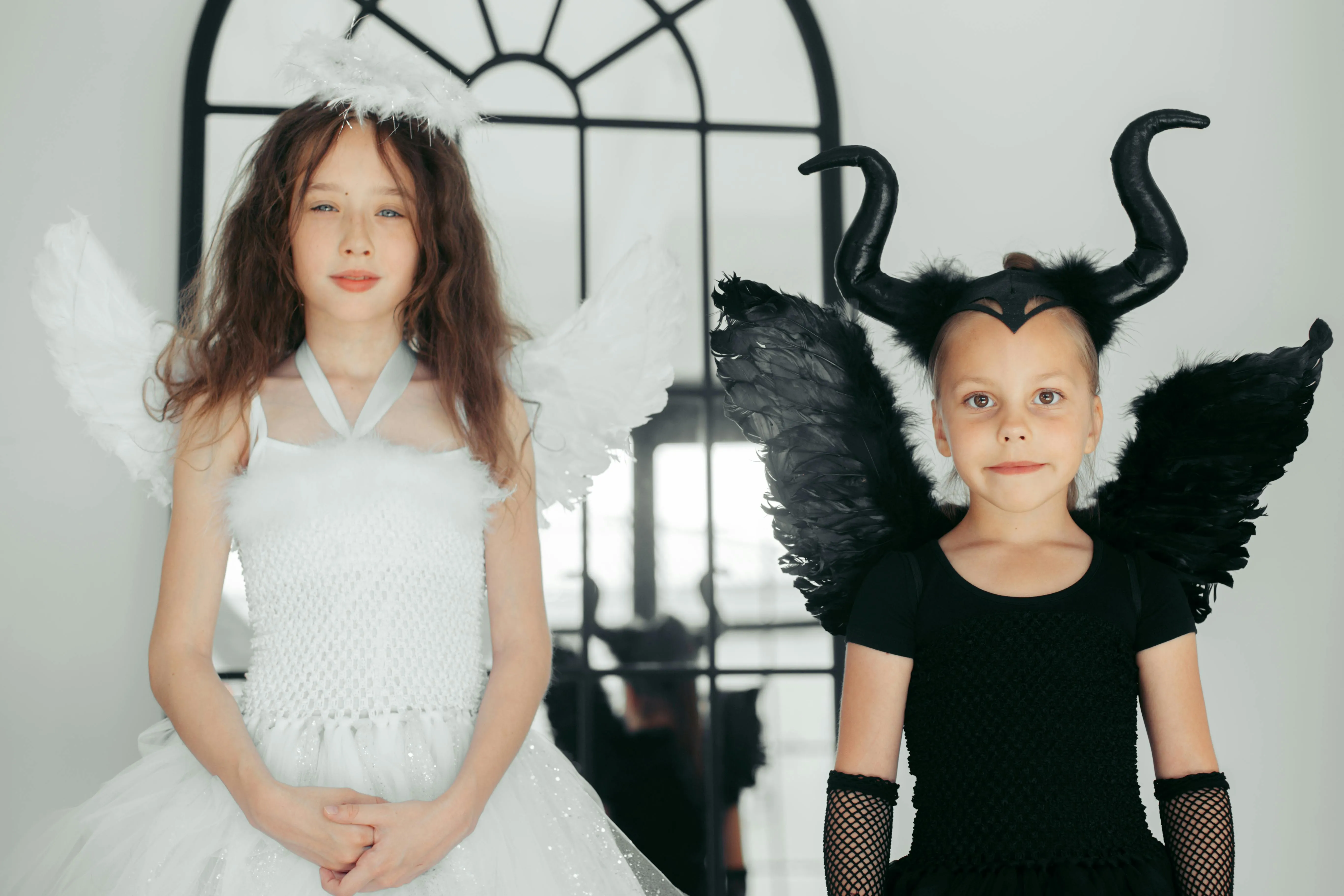 Two Girls in Halloween Costumes with Wings Wallpaper