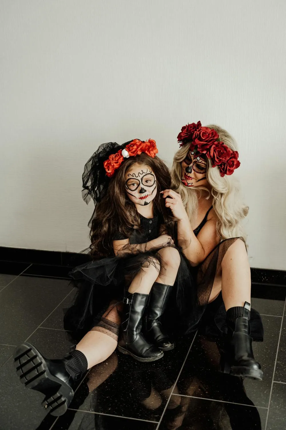 Two Girls Wearing Floral Headbands in Halloween Attire