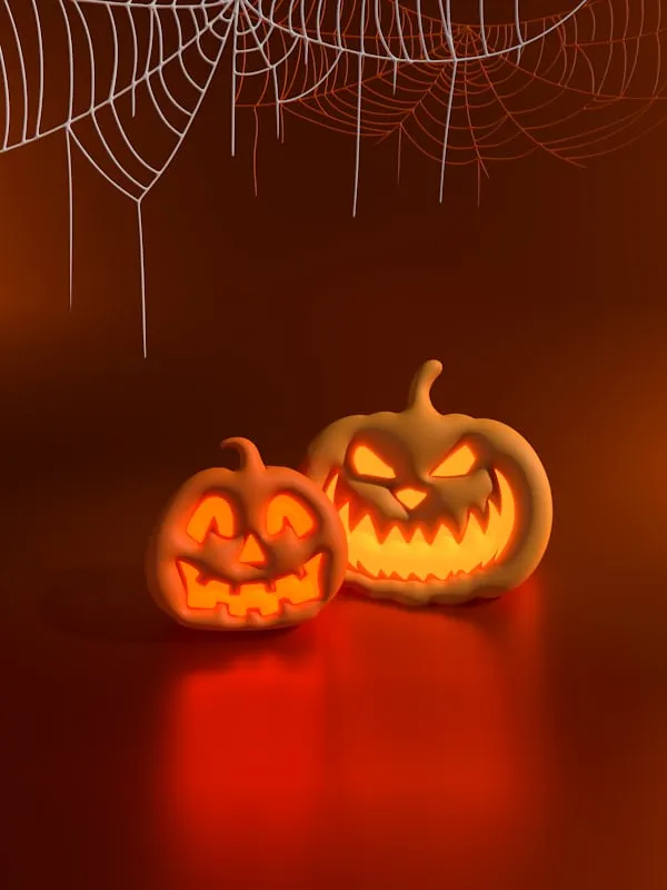 Two Glowing Pumpkins with Spider Web on Red Background