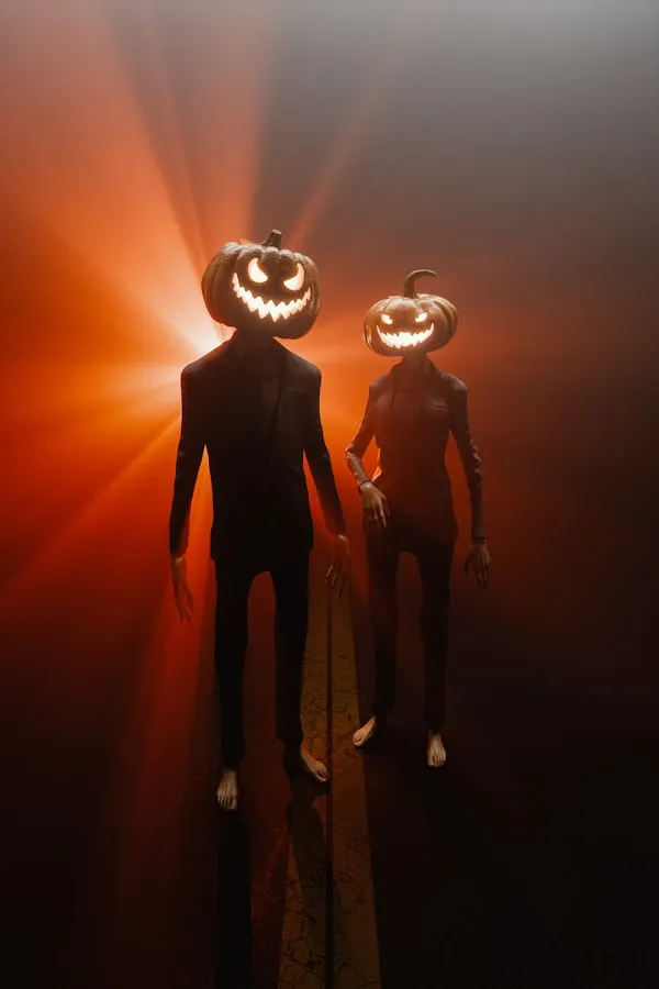 Two Jack O Lantern Dolls with Glowing Faces in Orange Light
