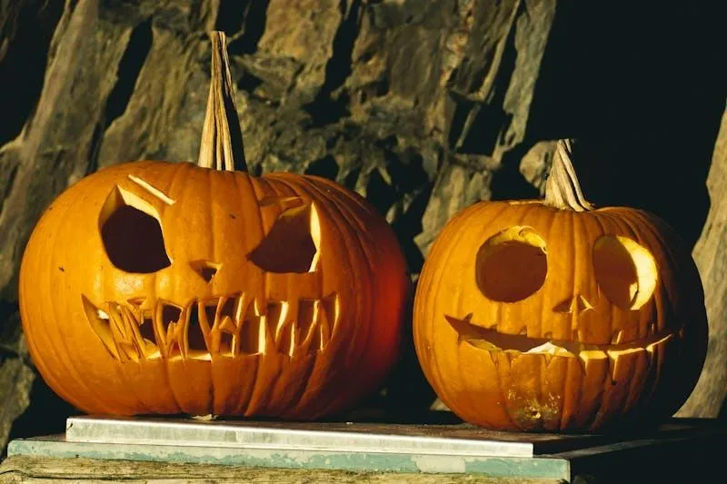 Two Jack O Lanterns Glowing in a Dark Cave HD Wallpaper